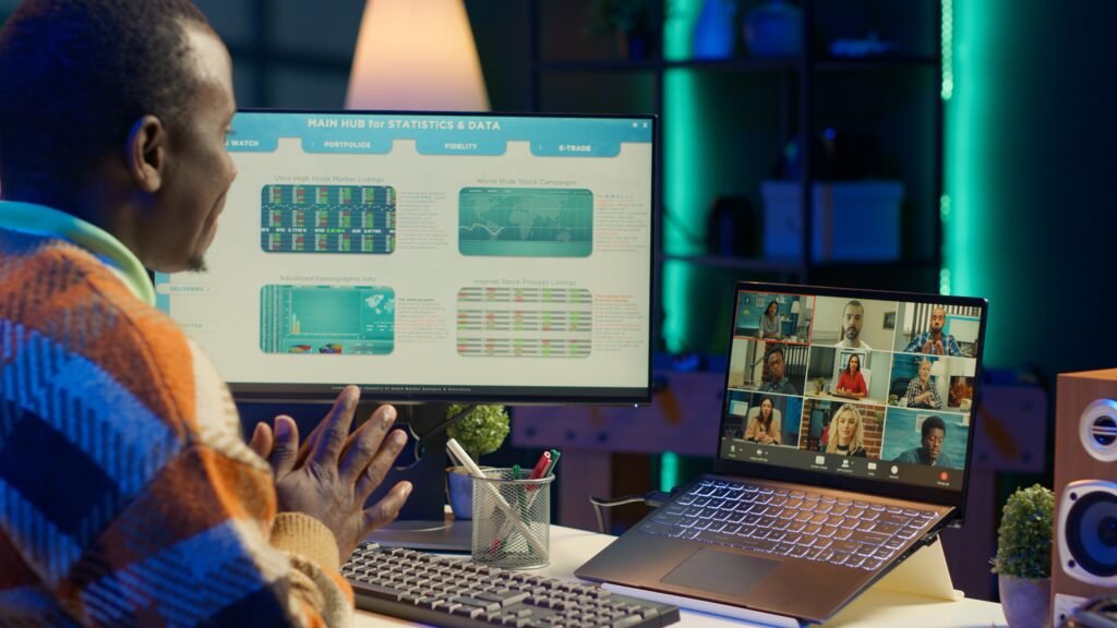 african american male freelancer attends meeting call with clients laptop