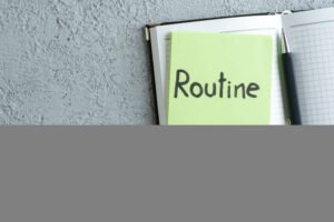 top view routine written note green sticker with notepad pen white background college color job copybook school office photo business 1
