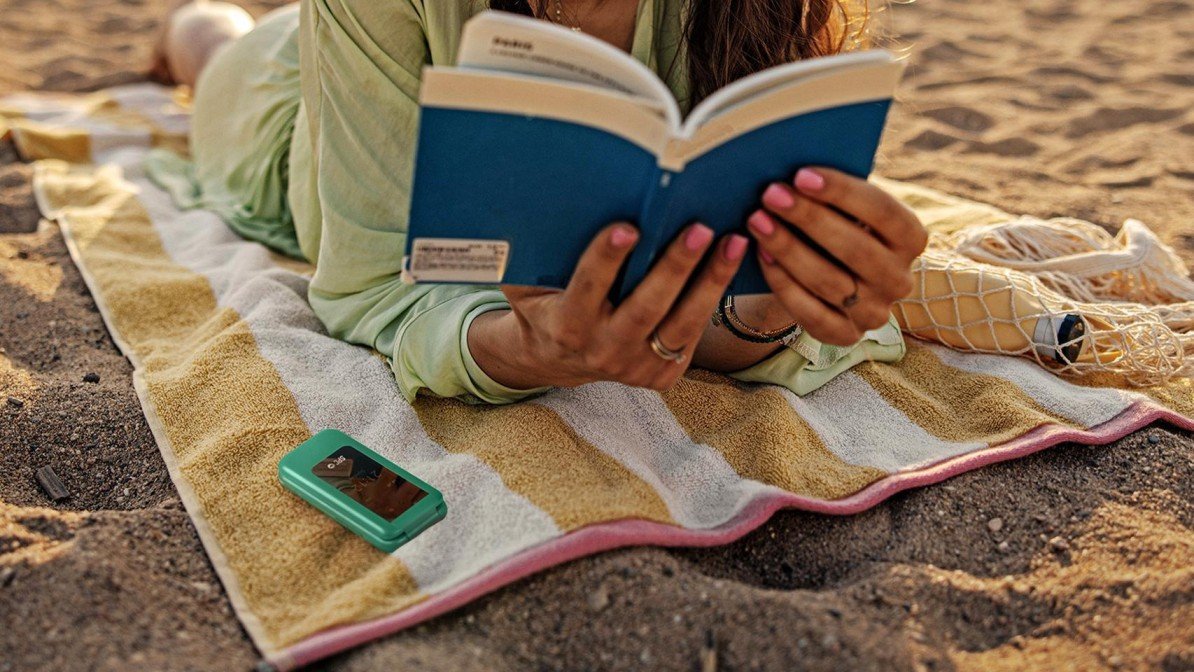 How to Reduce Screen Time: 10 Simple Ways to Improve Daily Life 2 Person reading a book instead of scrolling on a phone